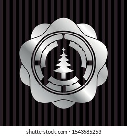 christmas tree icon inside silvery emblem or badge