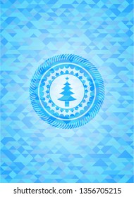christmas tree icon inside sky blue emblem. Mosaic background