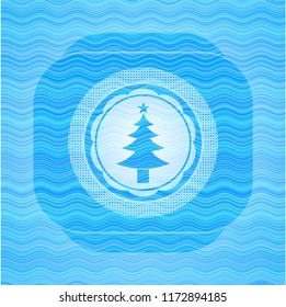christmas tree icon inside water representation emblem background.