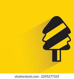 Christmas tree icon with shadow on yellow background