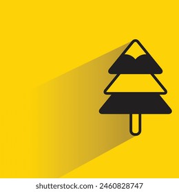Christmas tree icon with shadow on yellow background