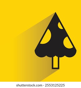 Icono del árbol de navidad con la sombra en el fondo amarillo