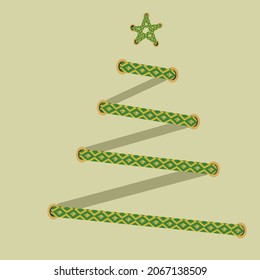 Christmas tree made of green-gold lacing with star. 