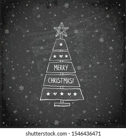 Christmas tree made of sawn wood board. Christmas card in simple rustic style on blackboard background