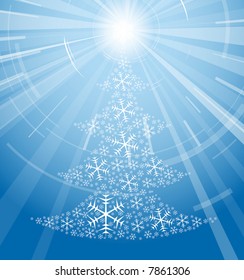 Christmas tree made from snowflakes on blue background