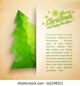 Christmas tree made of triangles on a paper background. Vector illustration.