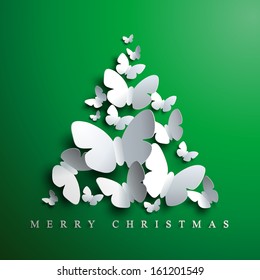  Christmas tree made of white paper butterflies on green background