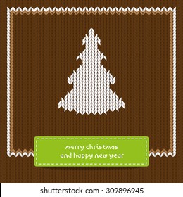 Christmas tree on Christmas brown knitting background 