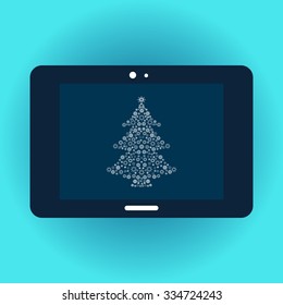 Christmas tree on the tablet screen. Gadgets technology gifts for Christmas