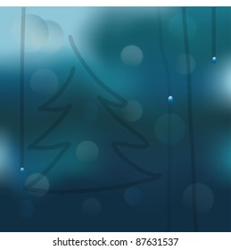 Christmas tree on a wet window