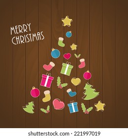 Christmas tree from ornaments on wooden background