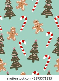 Christmas tree pattern and candy and biscuits on green background.