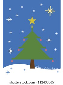 christmas tree standing outside in the snow