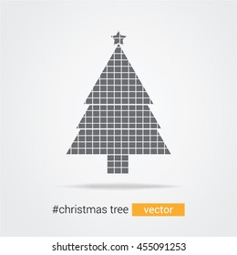 Christmas tree with a star toy on top and made out of tiles
