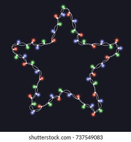 Christmas tree string colorful garland in star shape and text space isolated on dark background. Realistic Christmas, New Year party decorations with transparency. Light bulb decor. Lights border