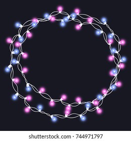 Christmas tree string garland in circle shape and text space isolated on dark background. Realistic Christmas, New Year party decorations with transparency. Light bulb decor. Lights border