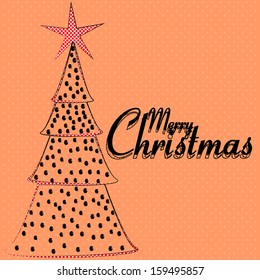 Christmas tree topped with a black dots red dots star