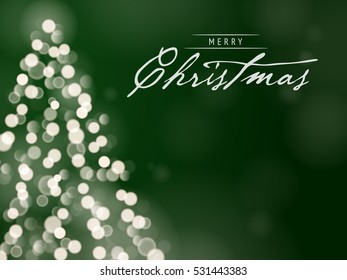 Christmas Tree Unfocused Blurred Lights on the Dark Green Background with a Merry Christmas Message
