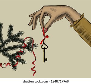 Christmas tree.  Woman's hand with gold keys on a spruce branch with a ribbon. Vintage engraving stylized drawing. Vector illustration
