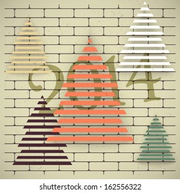 Christmas trees on an old brick wall. Grunge background.