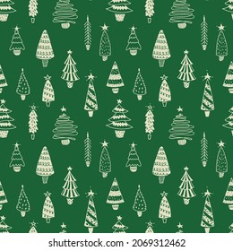 Christmas trees seamless pattern. Holiday trees collection on green background