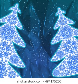 Christmas trees from snowflakes. Blue  background