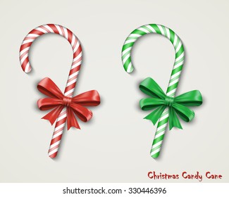 Christmas two realistic Candy Cane with red and green bow isolated on white background. Happy holidays and merry celebrations. Vector illustration EPS10