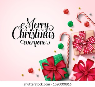 Christmas vector background template. Merry christmas everyone greeting text in empty space for message with xmas decor like gifts, balls, candy cane and stars elements in pink background.