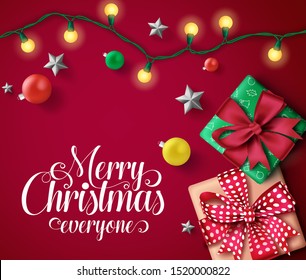 Christmas vector banner template. Merry christmas everyone typography text in empty space with colorful xmas decor elements of gifts, balls, lights and silver stars in red background.