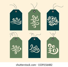 Christmas vector gift tags and handwritten calligraphy lettering text 2020. Xmas decorative elements