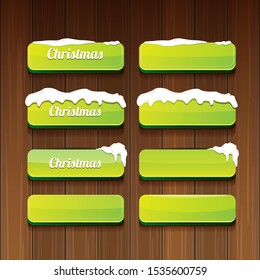 Christmas vector green glossy buttons set isolated on wooden background. web green christmas sale buttons with snow, ice border