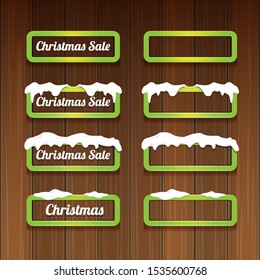Christmas vector green glossy buttons set isolated on wooden background. web green christmas sale buttons with snow, ice border