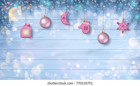 Christmas vector ornaments and branches of fir tree with hanging textile handmade decorations on a wooden plank background