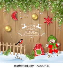 Christmas vector ornaments, textile toys and branches of fir tree with hanging decorations on a wooden plank background