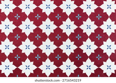 Padrão de vetor de Natal com formas de estrelas vermelhas e brancas e centros florais azuis. Ideal para decoração festiva de férias, têxteis sazonais, papel de embrulho e projetos de design decorativo.