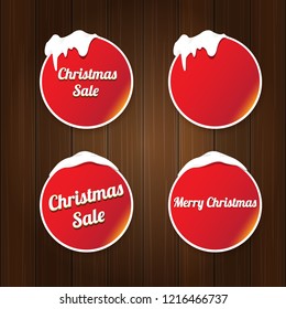 Christmas vector red glossy buttons set isolated on vintaeg wooden sign background. web red christmas sale buttons with snow, ice border