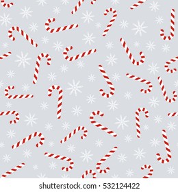 Christmas vector seamless pattern with candy canes and snowflakes. Background for wrapping paper, fabric print, greeting cards design