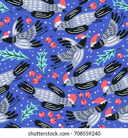 Christmas vector seamless pattern with funny flying birds and holly berries