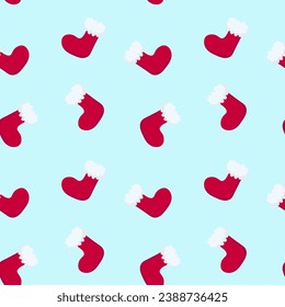 Christmas vector seamless pattern with red socks with fur on a blue background. Xmas background for wrapping paper, textile, web pages.