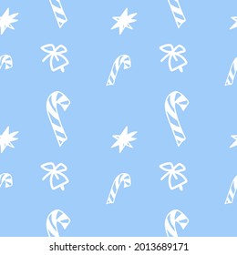 Christmas vector seamless pattern with white lollipop,stars and bell.Holiday print on blue isolated background in doodle hand drawn style.Design for wrapping paper,textiles,packaging,social media,web.