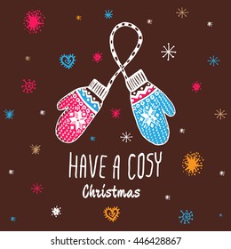 Christmas vintage card with with hand drawn mittens and text 'Have a Cosy Christmas'. Vector hand drawn illustration on brown background.