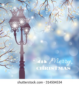 Christmas vintage card with street lamp on defocused background