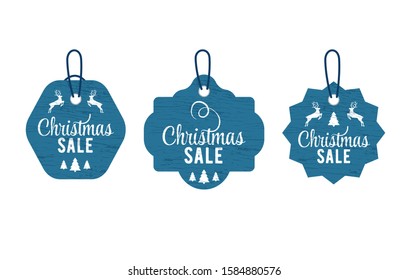 Christmas vintage tag set lettering in beautiful style on white background. Vector card design. Vector badge. Christmas tree decoration. Silhouette deer and tree. Design element set
