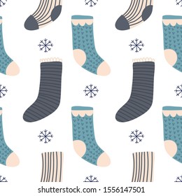 Christmas warm socks and snowflakes. Pattern vector background.