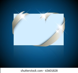 Christmas or wedding card - silver ribbon around blank blue paper, where you should write your text