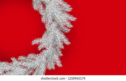 Christmas white branch of spruce on red background with copy space.