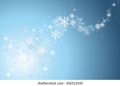 Christmas winter background with swirl of snowflakes on blue