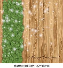 Christmas wood background with fir tree, snowflakes.