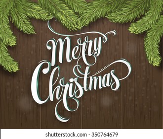 Christmas wooden background with fir branches. Vector illustration. Christmas calligraphy. Hand drawn design elements. Inscription is handmade. Christmas card