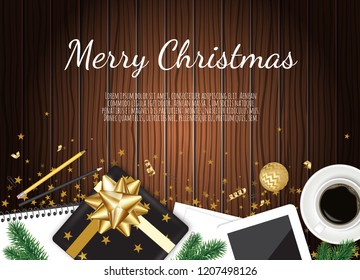 Christmas working place. Christmas gift box, coffee mug on brown wooden table.